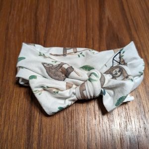 Copper pearl sloth infant bow